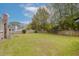 Expansive backyard with lush green grass, mature trees, and a privacy fence at 1109 Lee Shore Ln, Mount Pleasant, SC 29464
