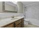 This bathroom features a marble vanity, a decorative mirror, and a shower-tub combo at 1109 Lee Shore Ln, Mount Pleasant, SC 29464