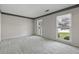 Spacious bedroom with plush carpet, featuring bright natural light and double windows at 1109 Lee Shore Ln, Mount Pleasant, SC 29464