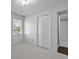 This bedroom has plush carpet flooring, a large closet, neutral walls, and a sunny window at 1109 Lee Shore Ln, Mount Pleasant, SC 29464