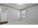 Bedroom with neutral-toned carpet, window, closet and connecting door open to another room at 1109 Lee Shore Ln, Mount Pleasant, SC 29464