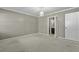 A bedroom with neutral walls and carpet that leads to a bathroom and closet area at 1109 Lee Shore Ln, Mount Pleasant, SC 29464