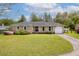 Charming single-story brick home with a manicured lawn and attached one car garage at 1109 Lee Shore Ln, Mount Pleasant, SC 29464