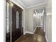 Foyer with a decorative front door and hardwood floors, leading into a hallway with elegant lighting at 1109 Lee Shore Ln, Mount Pleasant, SC 29464