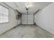 This clean and empty two-car garage has white walls and ceiling at 1109 Lee Shore Ln, Mount Pleasant, SC 29464