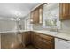 Kitchen with wood cabinets and countertops, connecting to a living room with hardwood floors and a fireplace at 1109 Lee Shore Ln, Mount Pleasant, SC 29464