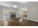 Cozy living room with hardwood floors, brick fireplace, and view of kitchen at 1109 Lee Shore Ln, Mount Pleasant, SC 29464