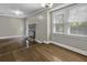 Bright living room with hardwood floors, a brick fireplace, and large windows at 1109 Lee Shore Ln, Mount Pleasant, SC 29464