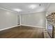 Cozy living room with hardwood floors, a brick fireplace, and neutral wall paint at 1109 Lee Shore Ln, Mount Pleasant, SC 29464