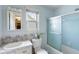 Traditional bathroom featuring a shower with glass sliding door and window for natural lighting at 1144 Island View Dr, Mount Pleasant, SC 29464