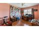 A bedroom with hardwood floors, a ceiling fan, and a window with a desk in front of it at 1144 Island View Dr, Mount Pleasant, SC 29464