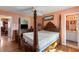 Bedroom featuring a four-poster bed, hardwood floors, and doorway into another room at 1144 Island View Dr, Mount Pleasant, SC 29464