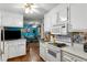 Bright kitchen with white cabinetry, modern appliances, and hardwood floors at 1144 Island View Dr, Mount Pleasant, SC 29464