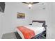 Cozy bedroom with gray headboard, white linens and unique patterned rug at 1174 Pittsford Cir, Charleston, SC 29412