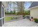 Spacious wooden deck perfect for entertaining guests and relaxing, complemented by plants and backyard access at 1174 Pittsford Cir, Charleston, SC 29412