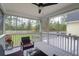 Comfortable screened porch with ceiling fan and outdoor furniture, perfect for relaxing and enjoying the backyard view at 1174 Pittsford Cir, Charleston, SC 29412