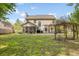Spacious backyard with a screened porch, patio, and charming pergola at 119 Oakbluff Rd, Summerville, SC 29485