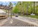 Outdoor patio boasts pergola, wood deck, stone fire pit, and private fence at 119 Oakbluff Rd, Summerville, SC 29485