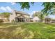 Spacious backyard with a screened in porch, a deck, and mature landscaping at 119 Oakbluff Rd, Summerville, SC 29485