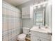 Bright bathroom featuring a vanity, toilet, and shower with striped curtain at 119 Oakbluff Rd, Summerville, SC 29485