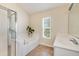 Bathroom featuring a glass-door shower, large tub, and a spacious vanity area at 119 Oakbluff Rd, Summerville, SC 29485