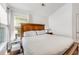 Bright bedroom featuring a beautiful bed, two windows, and white walls at 119 Oakbluff Rd, Summerville, SC 29485