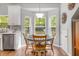Cozy breakfast nook with bay windows, wood table, and plenty of natural light at 119 Oakbluff Rd, Summerville, SC 29485