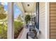 Inviting front porch with comfortable seating and charming curb appeal at 119 Oakbluff Rd, Summerville, SC 29485