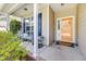 Inviting front porch with colorful door, bench seating, and charming curb appeal at 119 Oakbluff Rd, Summerville, SC 29485