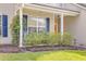Charming front porch with rocking chairs and lush landscaping at 119 Oakbluff Rd, Summerville, SC 29485