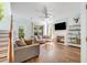 Comfortable living room features a fireplace, large windows, and ceiling fan at 119 Oakbluff Rd, Summerville, SC 29485