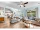 Bright living room with ample natural light, ceiling fan, and staircase at 119 Oakbluff Rd, Summerville, SC 29485