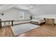 Vaulted ceiling bedroom filled with natural light offers hardwood floors, desk space, and neutral decor at 12 Leeann Ln, Mount Pleasant, SC 29464