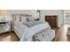 Comfortable bedroom features a tufted headboard, decorative pillows, and a mirrored side table at 12 Leeann Ln, Mount Pleasant, SC 29464