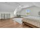 Spacious bedroom with vaulted ceilings boasts hardwood floors, a ceiling fan, and lots of natural light at 12 Leeann Ln, Mount Pleasant, SC 29464