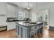 Bright kitchen features an island with bar seating and modern fixtures at 12 Leeann Ln, Mount Pleasant, SC 29464