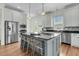 Bright kitchen features an island with bar seating, stainless appliances, and white cabinets at 12 Leeann Ln, Mount Pleasant, SC 29464