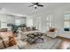Open-concept living room featuring hardwood floors and comfortable furniture at 12 Leeann Ln, Mount Pleasant, SC 29464