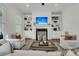 Bright living room with a fireplace, built-in shelving, and comfortable seating at 12 Leeann Ln, Mount Pleasant, SC 29464