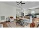 Spacious living room with hardwood floors flowing into a modern kitchen at 12 Leeann Ln, Mount Pleasant, SC 29464