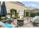 Private patio features a cozy fire pit, comfortable seating, and manicured landscaping at 12 Leeann Ln, Mount Pleasant, SC 29464