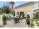 Backyard patio features a lovely fire pit, plush chairs, and well-manicured landscaping at 12 Leeann Ln, Mount Pleasant, SC 29464