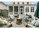 Outdoor patio boasts an inviting fire pit and cozy chairs, perfect for entertaining at 12 Leeann Ln, Mount Pleasant, SC 29464