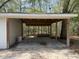 Covered carport area attached to a garage, offering ample parking space at 130 Oak Crest Dr, Moncks Corner, SC 29461