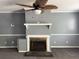 Cozy fireplace with a decorative mantel and adjacent storage, perfect for cozy evenings at 130 Oak Crest Dr, Moncks Corner, SC 29461