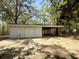 Spacious garage and carport with a concrete floor and natural light at 130 Oak Crest Dr, Moncks Corner, SC 29461
