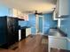 Bright kitchen featuring white cabinets, dark appliances, and a ceiling fan at 130 Oak Crest Dr, Moncks Corner, SC 29461