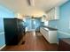 Spacious kitchen with light blue walls, white cabinets, and dark appliances at 130 Oak Crest Dr, Moncks Corner, SC 29461