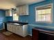 The bright kitchen features white cabinets, dark countertops, and hardwood floors at 130 Oak Crest Dr, Moncks Corner, SC 29461