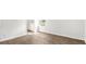 Bright bedroom with wood-look flooring and access to the ensuite bathroom at 131 River Hill Rd, Goose Creek, SC 29445